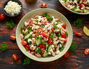 Bean Salad with Cherry Tomatoes, Cucumber, Red onion, Feta cheese and parsley. Healthy vegetarian, vegan diet food