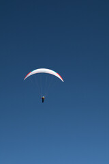 paragliding in the blue sky,sport, fly, paraglider, extreme,flying, air, gliding, adventure, sports, freedom, flight, wind, fun,