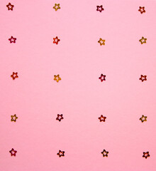 Floral pastel pattern with colorful glitter confetti florets on a pink background. Glowing. Backdrop design. Minimalism.