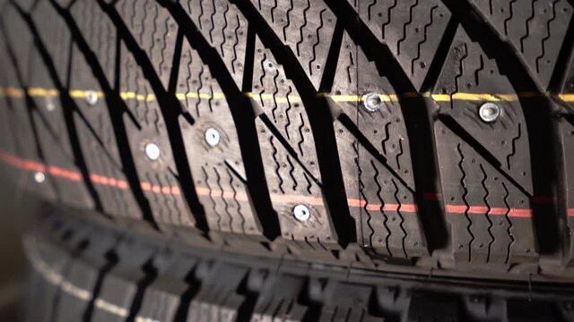 tread of new winter studded rubber wheel, close up
