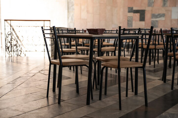 Fototapeta na wymiar Simple cafeteria interior with set of stylish furniture