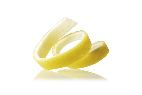 Wavy lemon peel on white isolated background.