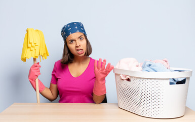 hispanic woman looking angry, annoyed and frustrated screaming wtf or what’s wrong with you