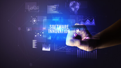 Hand touching SOFTWARE INNOVATION inscription, new business technology concept