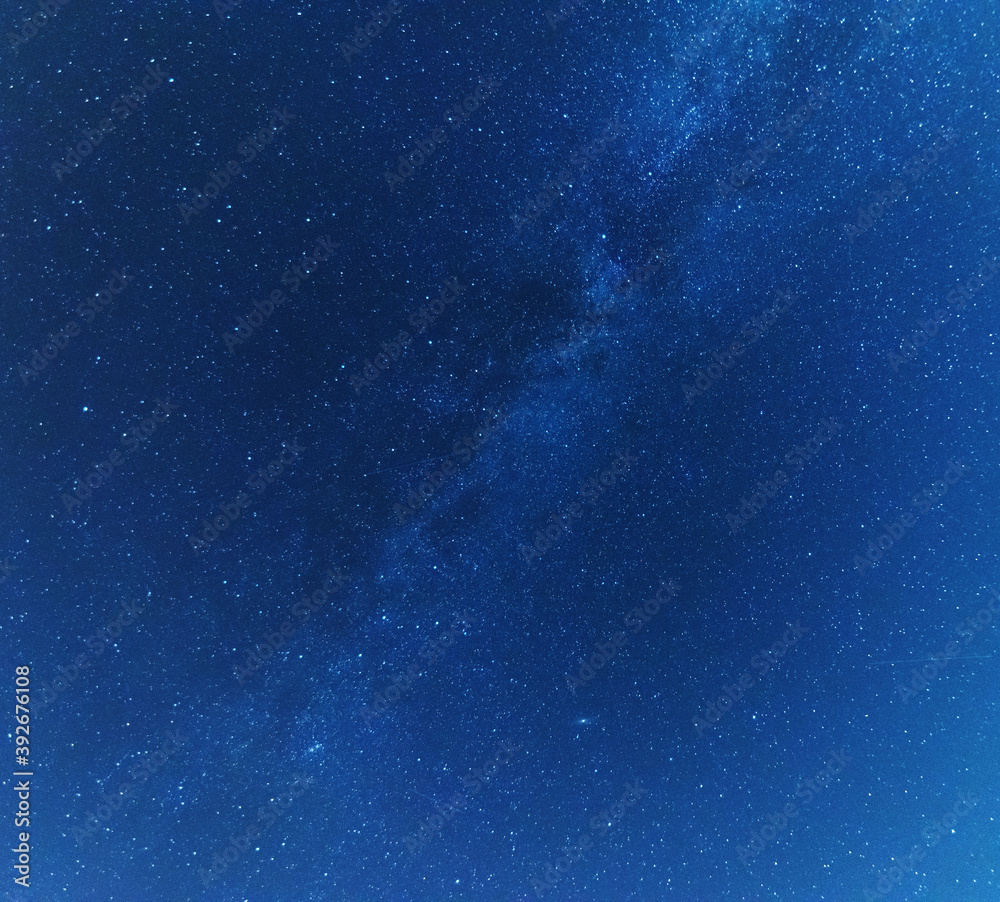 Wall mural a magical starry night on the river by the milky way and a comet in the sky