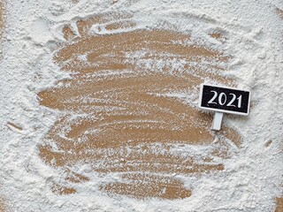 2021 chalkboard on flour background top view