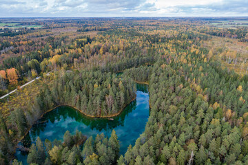 Sunset at blue lake. Beautiful autumn aerial footage.