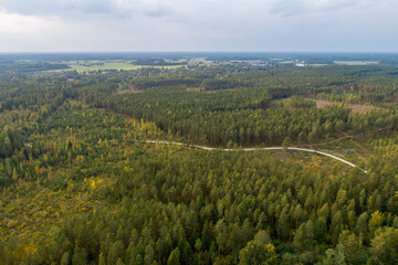Fototapeta na wymiar Aerial view of river among the forest. Summer nature landscape. Sunset.