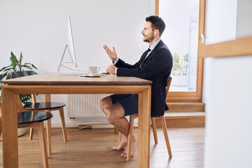 Businessman having video conference working from home