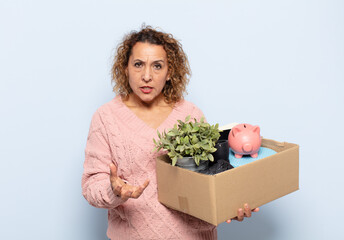 hispanic middle age woman looking angry, annoyed and frustrated screaming wtf or what’s wrong...