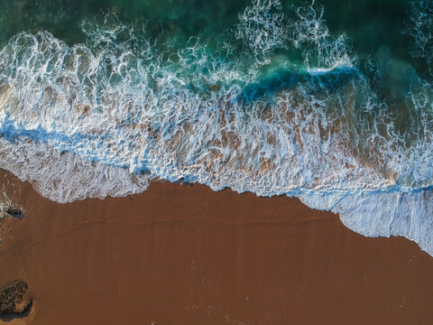 Aerial view of sea waves and sandy beach © nvphoto