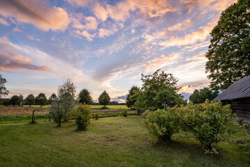 Traditional old farm house in Estonia. Sunset.