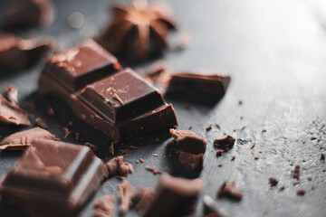 Chopped dark chocolate cubes close-up view