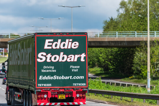 Northampton, UK - May 10th 2019: eddie stobart curtain side lorry truck on uk motorway in fast motion