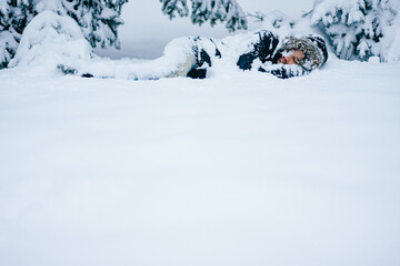Lonely man sleeping in the snow