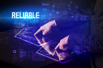 Hand touching digital table with RELIABLE inscription, new age security concept
