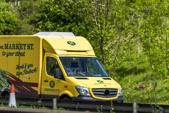 Northampton, UK - May 10th 2019: morrisons home delivery van on uk motorway in fast motion