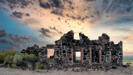 Idaho desert stone building ruins at sunset