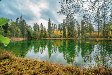 Fototapeta premium Beautiful blue lake in woods. autumn landscape.