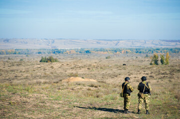 Russian special forces soldiers with weapon take part in military maneuver