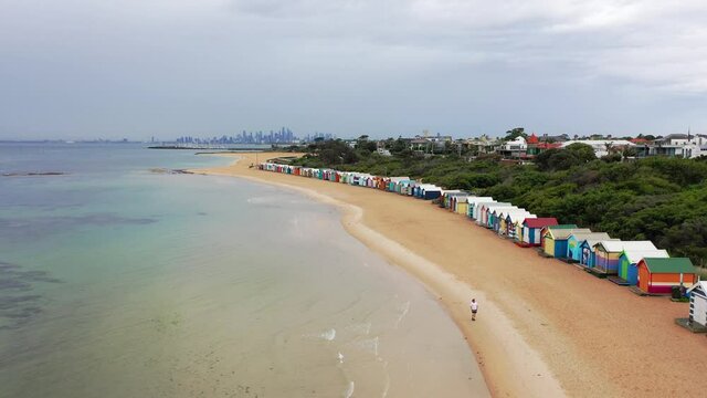 Drone Aeriel Footage at Brighton Beach Over Colourful Beach Houses / 82 distinctive Bathing Boxes Port Phillip Bay Melbourne Victoria Australia
