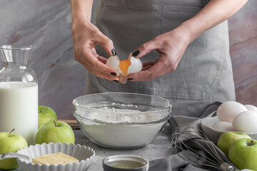 Close up of woman hands preparing sweet pie with apples