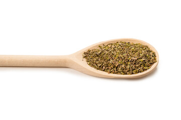Oregano spice in wooden spoon isolated.