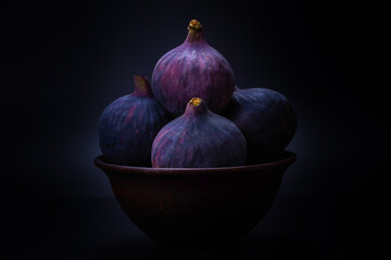 Tasty figs on a black background. Top view.