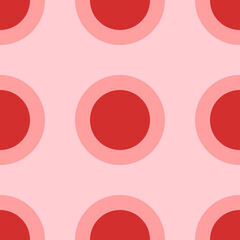 Seamless pattern of large isolated red circles. The elements are evenly spaced. Vector illustration on light red background