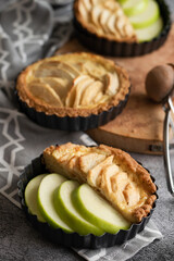 Ready to eat apple pies on grey background