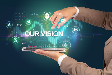 Close-up of a touchscreen with OUR VISION inscription, business opportunity concept