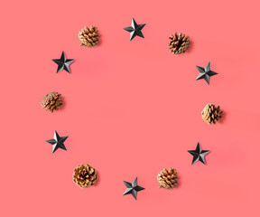 Fototapeta na wymiar Christmas pinecones with star ornaments - flat lay