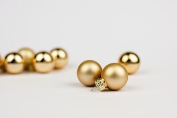 Christmas gold balls on white background