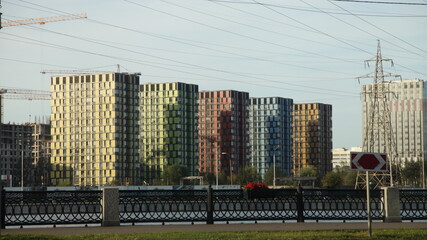 Moscow / Russia – 09 01 2020: Multicolored square houses of the Technopark residential complex on the Moskva river embankment on a summer day, modern urban architecture