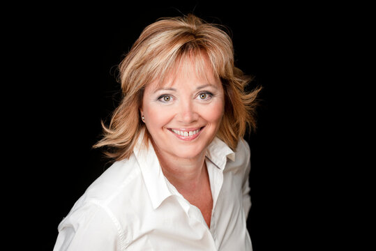 Portrait Of Attractive Senior Woman In Black Background