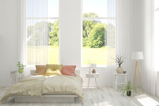 Stylish bedroom in white color with summer landscape in window. Scandinavian interior design. 3D illustration