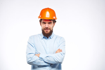 Engineer in orange coloring construction professional safety industry light background