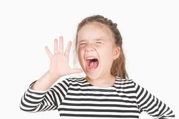 Shouting loud girl with five fingers up, showing Number five. Close up of posing little girl with tightly closed eyes and wide-open mouth. The model is wearing a striped shirt on isolated background.