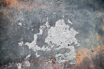 gray old wall. dark concrete texture. crumbling plaster on the building. discreet creative background