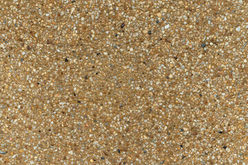 Blank concrete brown rough wall for background. Beautiful brown exposed aggregate wall plastered surface background pattern.