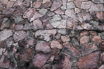 stone background. creative gray texture. colored mosaic. wall made of slabs.