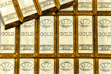 Top view of shiny gold bars stacked up in rows. Gold Bars 1000 grams. Concept of success in business and finance.