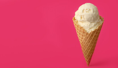 Delicious ice cream in waffle cone on pink background. Space for text