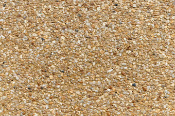 Blank concrete brown rough wall for background. Beautiful brown exposed aggregate wall plastered surface background pattern.