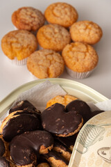Freshly baked tasty sugar coated muffin on a white table