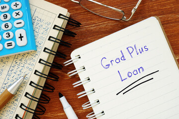 Financial concept meaning Grad Plus Loan with phrase on the page.