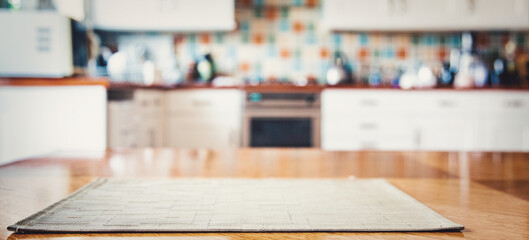 blurred kitchen interior with napkin on table