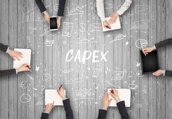 Group of business people working in office with CAPEX inscription, coworking concept - obrazy, fototapety, plakaty