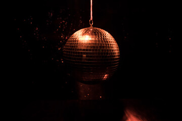 Obraz premium Colorful disco mirror ball lights night club background. Party lights disco ball. Selective focus