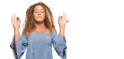Beautiful caucasian teenager girl wearing summer dress relax and smiling with eyes closed doing meditation gesture with fingers. yoga concept.